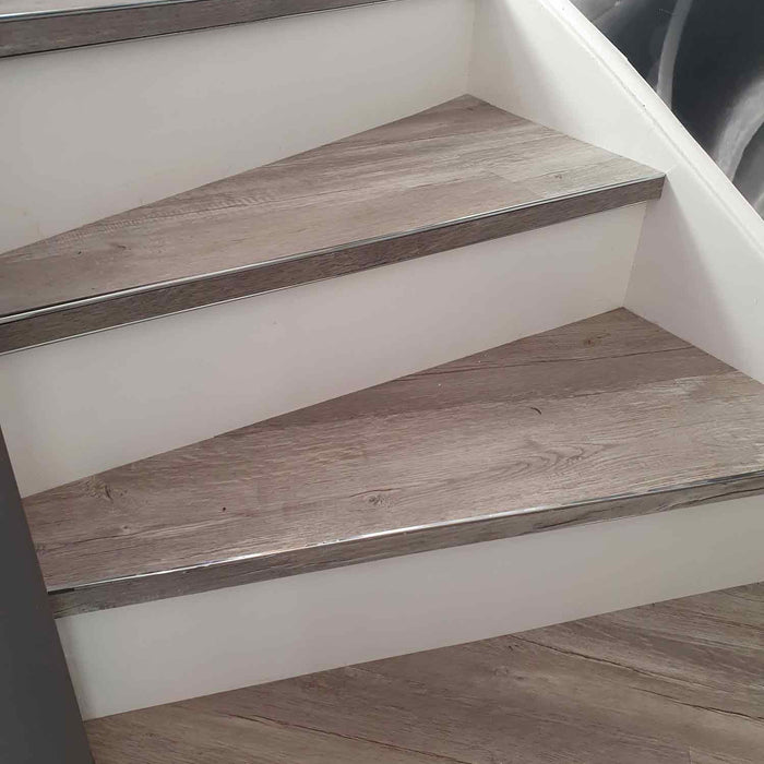 Premier bendy bull stair edge fitted to winding staircase fitted with wood-look LVT