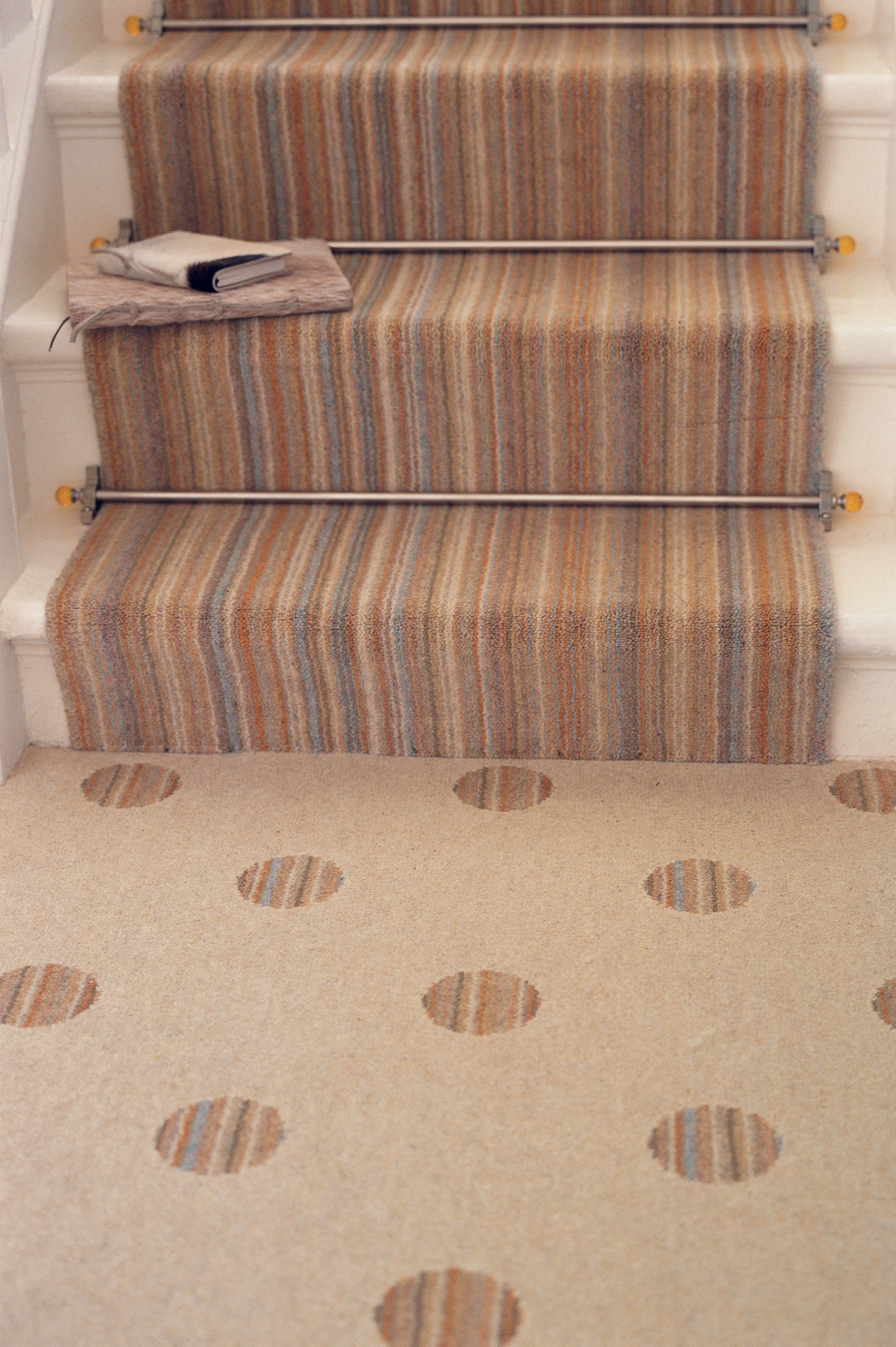 Amber Crystal stair rods fitted on striped runner stair carpet