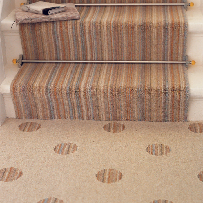 Amber Crystal stair rods fitted on striped runner stair carpet