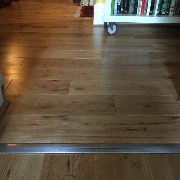 Premier Posh room dividing strip between wood floors