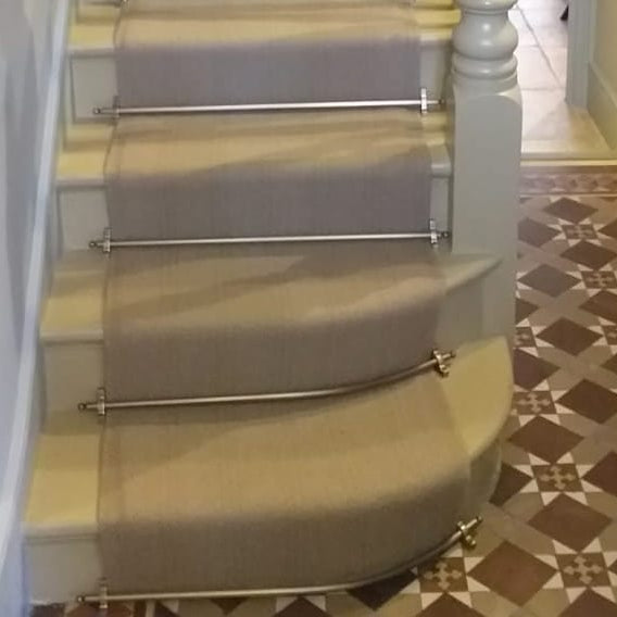 Curved stair rods for bottom steps