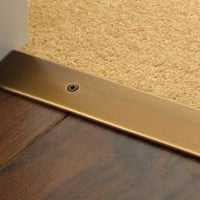 Premier Cover plate with matching screws in antique bronze joining carpet to wood