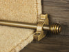 Sphere stair rods polished brass on green striped runner