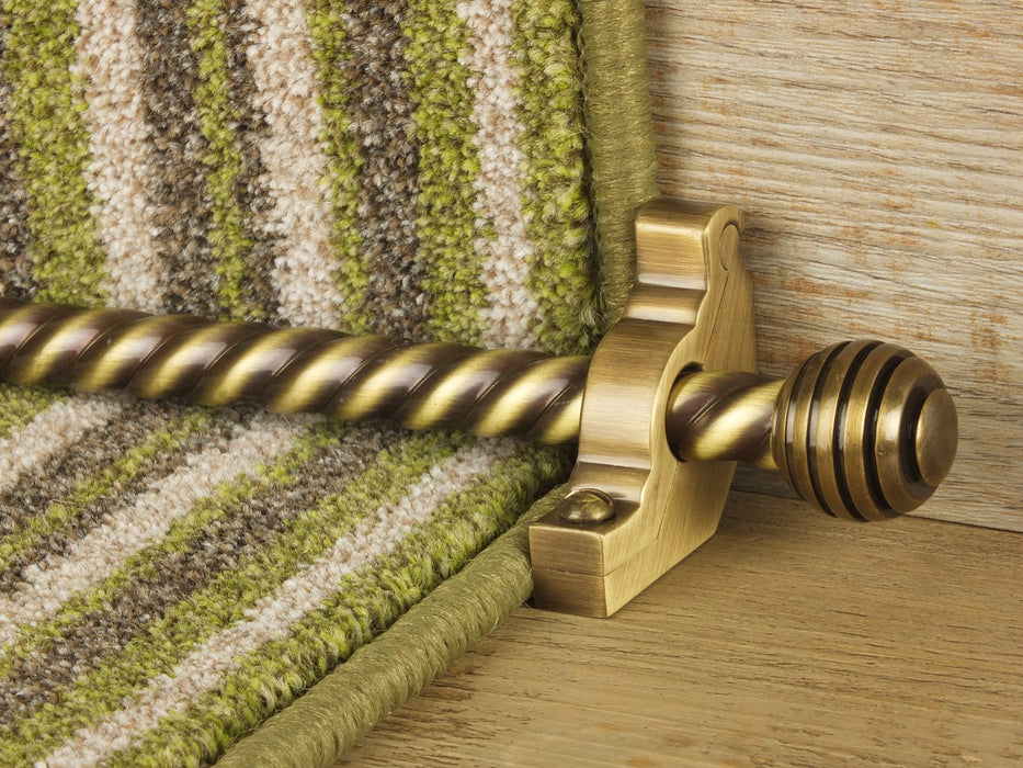 Sphere stair rods polished brass on green striped runner