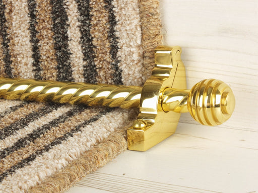 Sphere stair rods polished brass on green striped runner