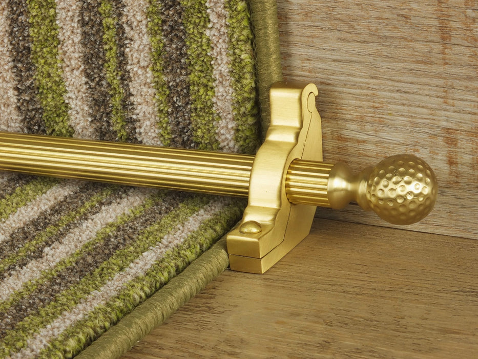 Extra large Dune stair rods on striped carpet