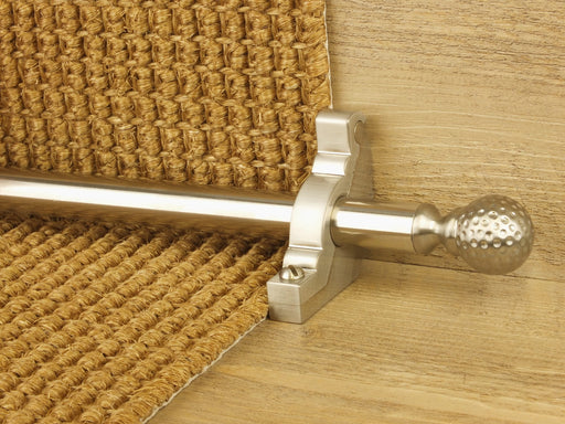 Extra large Dune stair rods on striped carpet