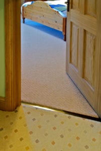 Posh door thresholds fitted on landing, carpet to carpet